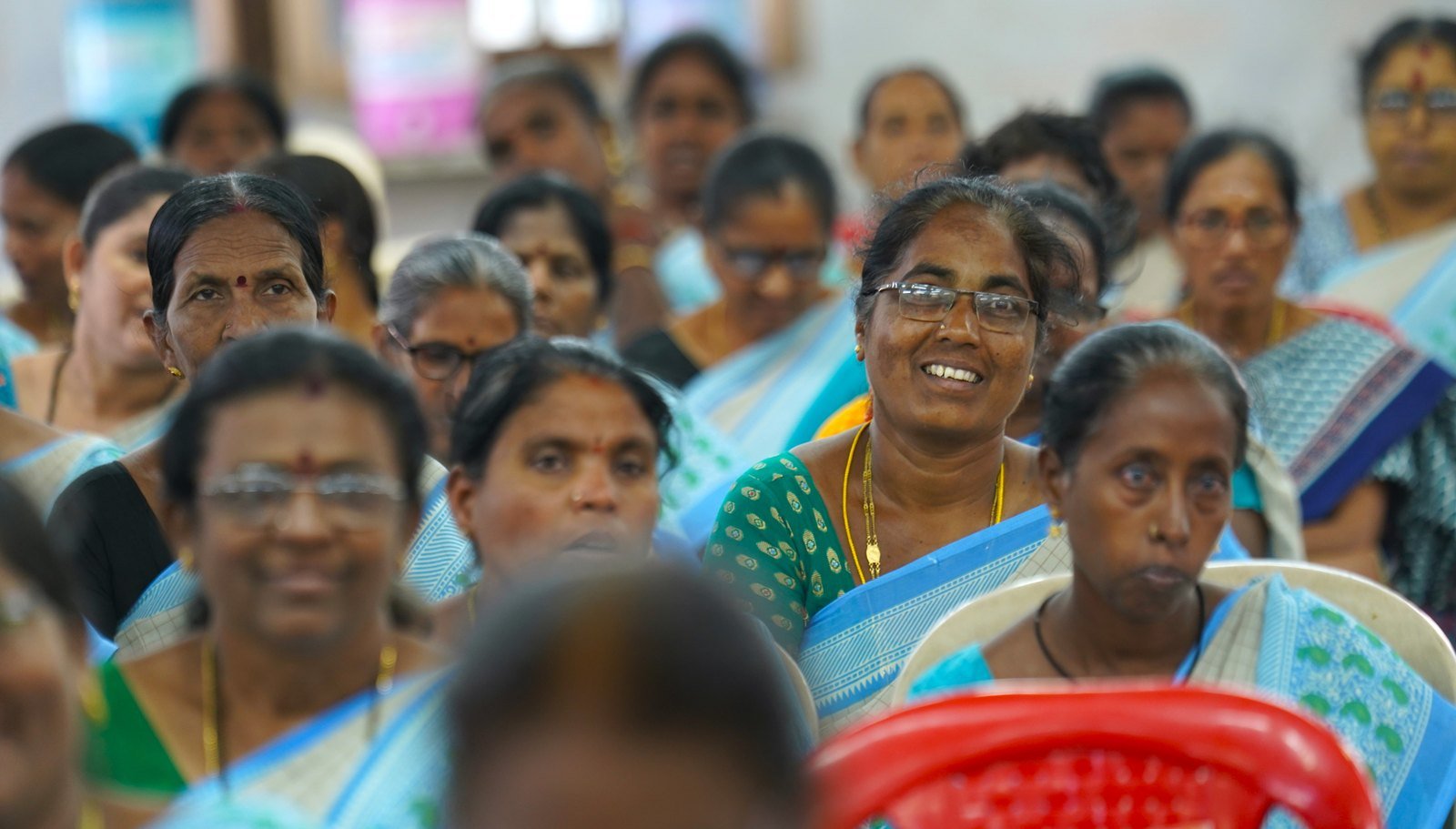 Large gathering of women participating in a community leadership conference